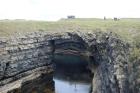 Upper Carboniferous Ross Sandstone formation eroded by wave action to leave a standing arch of sand or 